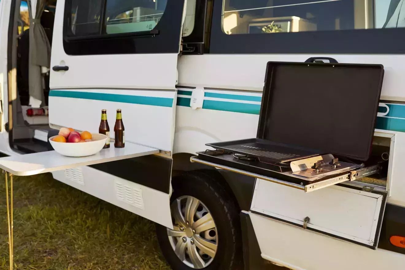 Outdoor cooking setup on a RentMeRV campervan